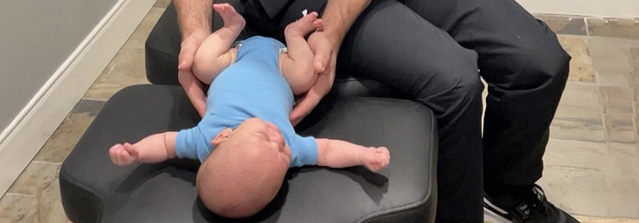 Chiropractor Conroe TX Ryan Roeder Adjusting An Infant Patient